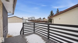 Wooden terrace featuring a residential view - 