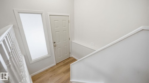 Entryway with light wood finished floors and baseboards - 3419 143 Avenue Nw, Edmonton, AB - Indoor Photo Showing Other Room