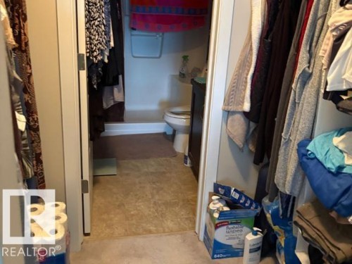 Bathroom featuring vanity and a shower with shower curtain - 118 396 Silverberry Road Nw, Edmonton, AB - Indoor