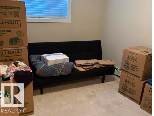 Bedroom featuring light carpet - 118 396 Silverberry Road Nw, Edmonton, AB - Indoor