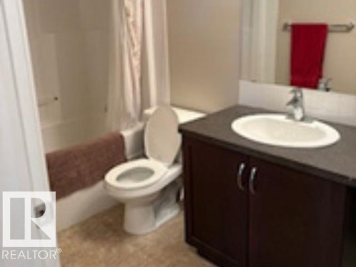 Bathroom with vanity and shower / tub combo with curtain - 118 396 Silverberry Road Nw, Edmonton, AB - Indoor Photo Showing Bathroom