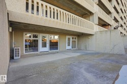 Doorway to property featuring a patio area and stucco siding - 