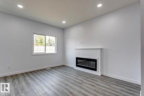 35 Caledon Crescent, Spruce Grove, AB - Indoor Photo Showing Living Room With Fireplace