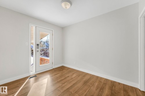 Empty room featuring wood finished floors and baseboards - 13911 117 Avenue, Edmonton, AB - Indoor Photo Showing Other Room
