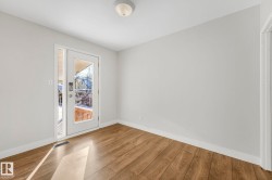 Empty room featuring wood finished floors and baseboards - 