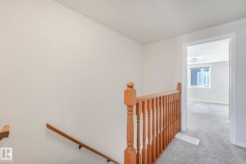 Stairs featuring carpet and baseboards - 13911 117 Avenue, Edmonton, AB - Indoor Photo Showing Other Room