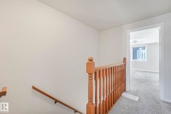 Stairs featuring carpet and baseboards - 