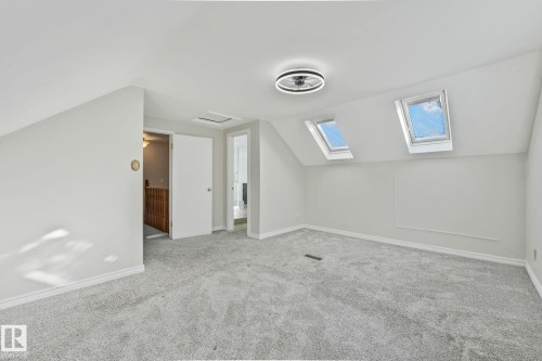 Bonus room featuring vaulted ceiling, carpet, and a skylight - 13911 117 Avenue, Edmonton, AB - Indoor Photo Showing Other Room