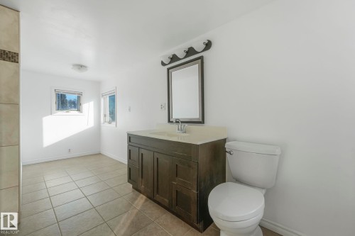 Bathroom featuring vanity and light tile patterned floors - 13911 117 Avenue, Edmonton, AB - Indoor Photo Showing Bathroom