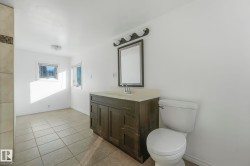Bathroom featuring vanity and light tile patterned floors - 