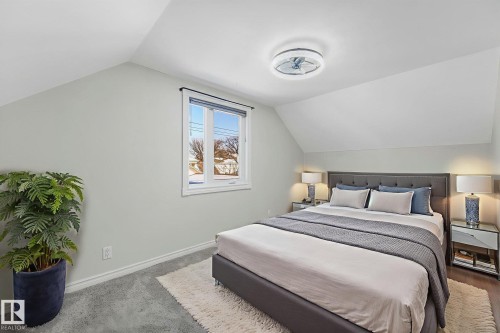 Bedroom featuring baseboards and carpet flooring - 13911 117 Avenue, Edmonton, AB - Indoor Photo Showing Bedroom