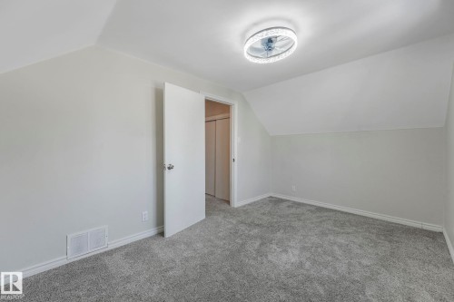 Bonus room featuring vaulted ceiling and carpet - 13911 117 Avenue, Edmonton, AB - Indoor Photo Showing Other Room