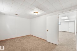 Finished below grade area featuring light carpet - 