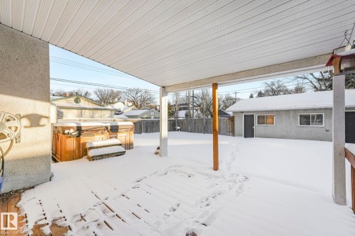 Yard covered in snow with a fenced backyard - 13911 117 Avenue, Edmonton, AB - Outdoor With Exterior