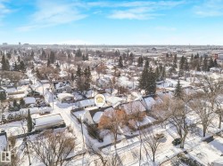Snowy aerial view featuring a residential view - 