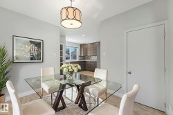 Dining space with light wood finished floors and recessed lighting - 