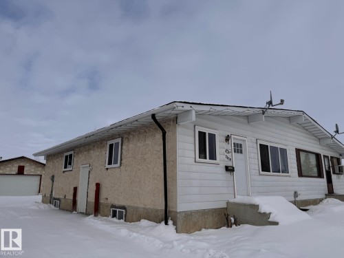 View of front of home featuring a detached garage - 2910 132A Avenue, Edmonton, AB - Outdoor