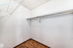 Walk in closet featuring parquet floors - 