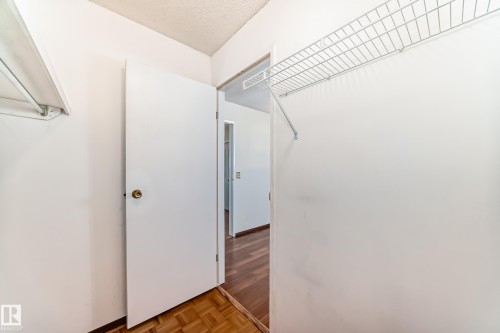 Walk in closet with parquet floors - 11922 138 Avenue, Edmonton, AB - Indoor Photo Showing Other Room