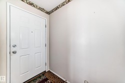 Doorway featuring baseboards - 