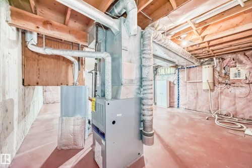 Utilities featuring heating unit - 11922 138 Avenue, Edmonton, AB - Indoor Photo Showing Basement