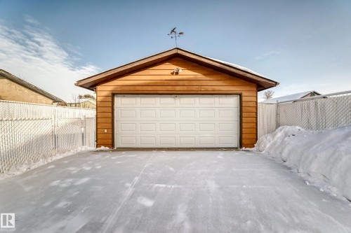 Snow covered garage with a garage - 11922 138 Avenue, Edmonton, AB - Outdoor With Exterior