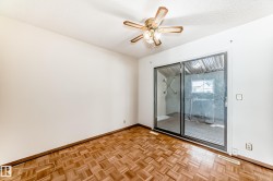 Unfurnished room with parquet floors, a textured ceiling, and ceiling fan - 