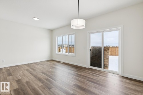 Spare room featuring wood finished floors and recessed lighting - 407 26 Street, Edmonton, AB - Indoor Photo Showing Other Room