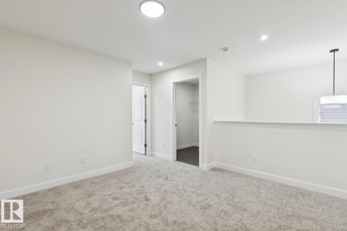 Unfurnished room with light colored carpet and recessed lighting - 407 26 Street, Edmonton, AB - Indoor Photo Showing Other Room