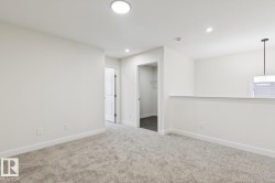 Unfurnished room with light colored carpet and recessed lighting - 