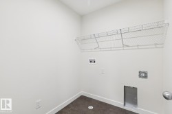 Laundry room with washer hookup and hookup for an electric dryer - 