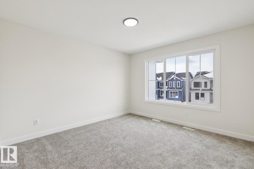 Carpeted empty room with baseboards - 407 26 Street, Edmonton, AB - Indoor Photo Showing Other Room