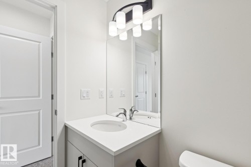 Half bath with vanity and toilet - 407 26 Street, Edmonton, AB - Indoor Photo Showing Bathroom