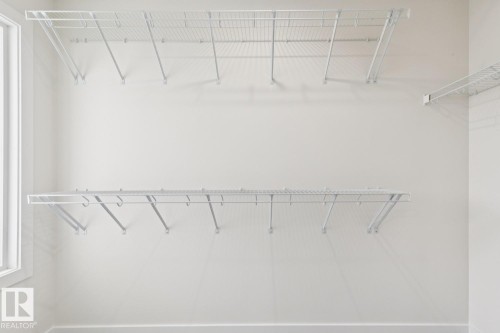 View of walk in closet - 407 26 Street, Edmonton, AB - Indoor With Storage