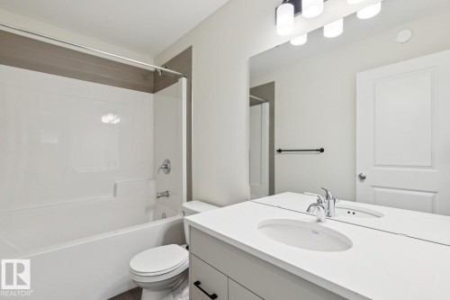 Full bath with vanity and bathing tub / shower combination - 407 26 Street, Edmonton, AB - Indoor Photo Showing Bathroom