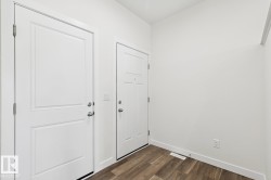 Entryway featuring baseboards and dark wood-type flooring - 