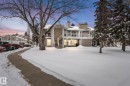 View of front of house with a chimney and a wooden deck - 36 2204 118 Street, Edmonton, AB  - Outdoor With Facade 
