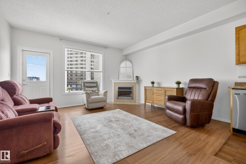 415 12111 51 Avenue, Edmonton, AB - Indoor Photo Showing Living Room With Fireplace