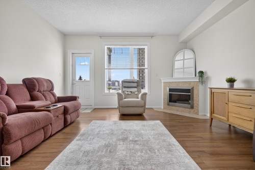 415 12111 51 Avenue, Edmonton, AB - Indoor Photo Showing Living Room With Fireplace