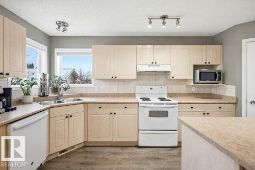 2 Heatherlands Way, Spruce Grove, AB - Indoor Photo Showing Kitchen With Double Sink
