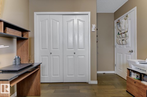 Office featuring dark wood-style floors and a textured ceiling - 20148 46 Avenue, Edmonton, AB - Indoor Photo Showing Other Room