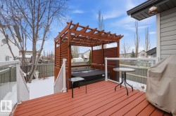 Wooden terrace featuring area for grilling - 