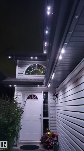 View of exterior entry at twilight - 20148 46 Avenue, Edmonton, AB 