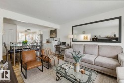 Living area featuring a textured ceiling, wood finished floors, and an office area - 