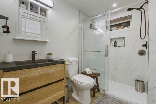Full bathroom featuring vanity and a marble finish shower - 13211 71 Street, Edmonton, AB - Indoor Photo Showing Bathroom