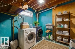 Laundry area with concrete floors and washer and dryer - 