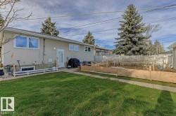 Back of house with a vegetable garden and a patio - 