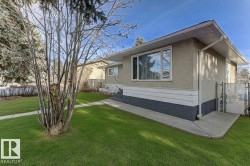 View of home's exterior featuring a gate and stucco siding - 