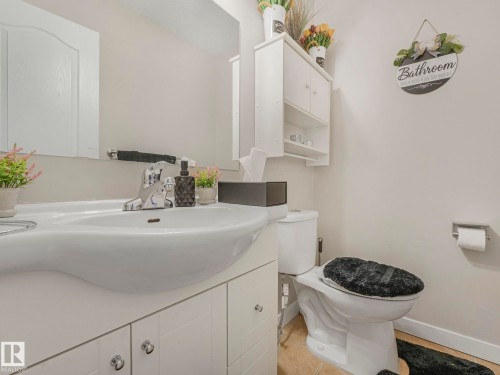 Half bathroom featuring vanity and toilet - 13271 47 Street, Edmonton, AB - Indoor Photo Showing Bathroom