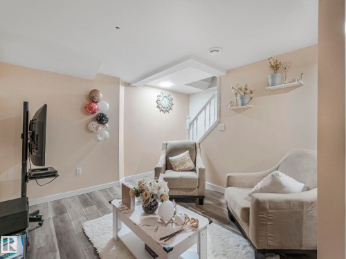 Living area with wood finished floors and baseboards - 13271 47 Street, Edmonton, AB - Indoor